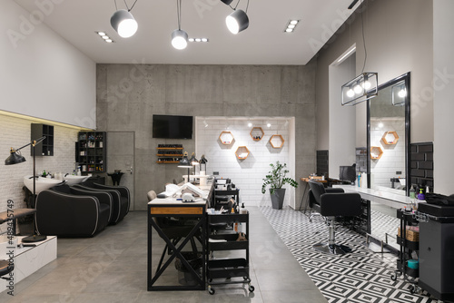 Obraz na płótnie Modern interior of the beauty salon which consist of nail salon and barbershop. w salonie