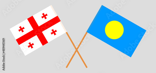 Crossed flags of Georgia and Palau. Official colors. Correct proportion