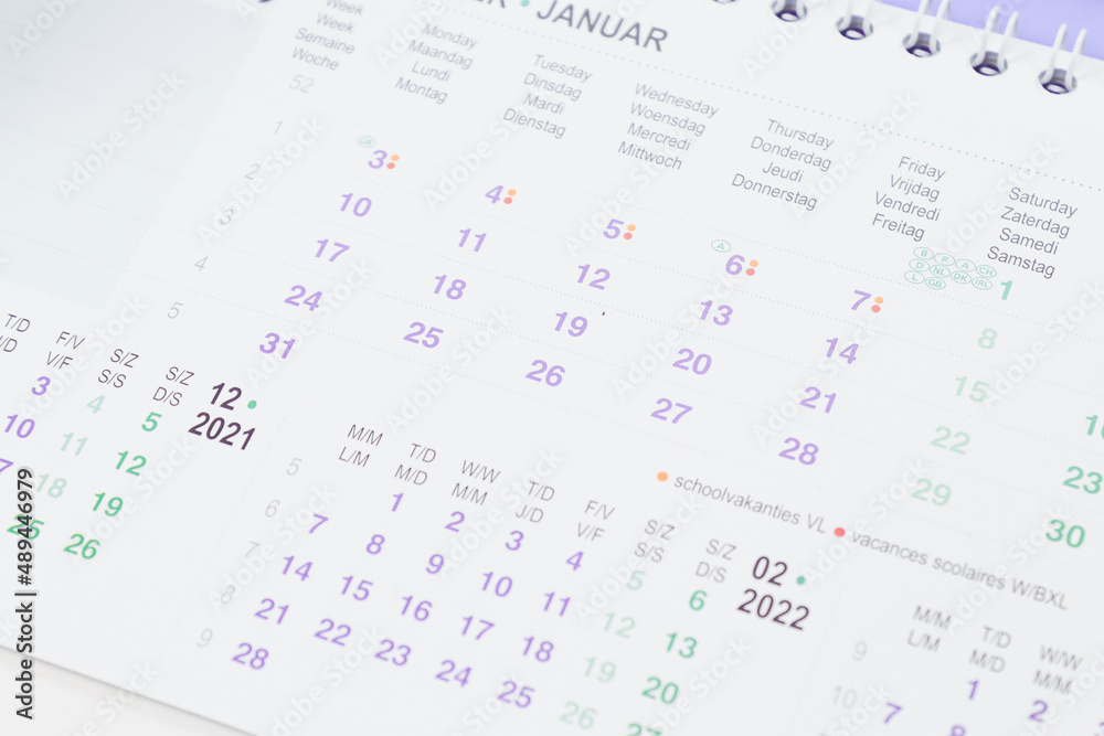 Paper desk calendar for January 2021-2022 with selective focus Paper desk calendar for January 2021-2022 with selective focus