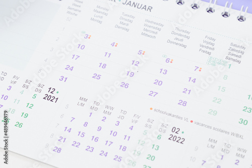 Paper desk calendar for January 2021-2022 with selective focus