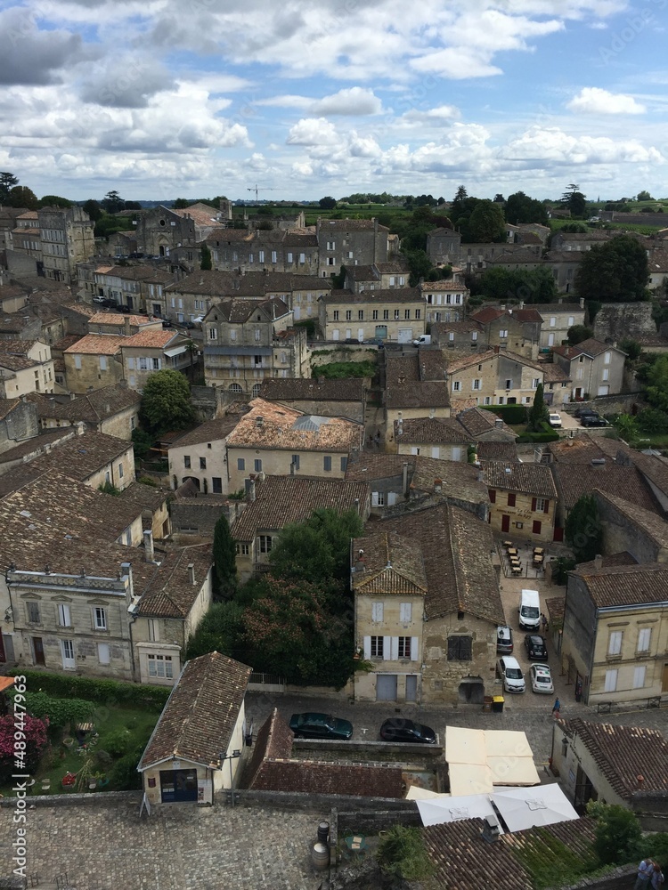 Saint Emilion, France, Bordeaux. Panoramic view of medieval town from King’s tower or La Tour du Roy. Panorama view of the medieval town. Limestone houses with shutters and tile rooftop. Old village i