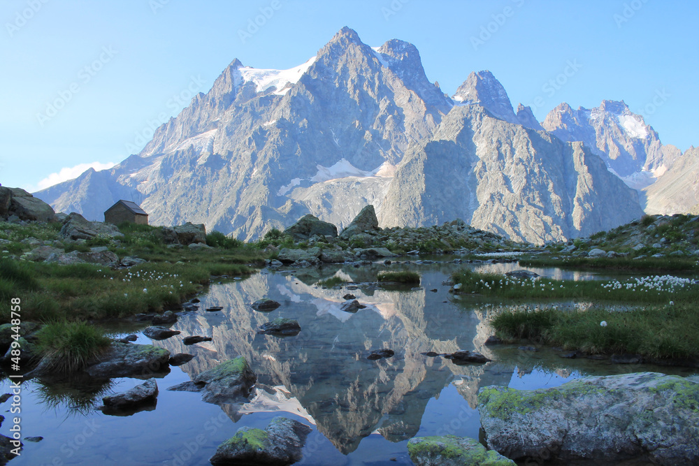 Amazing reflections in lake Tuckett looking Mont Pelvoux in the French alps
