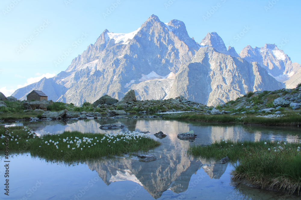 Amazing reflections in lake Tuckett looking Mont Pelvoux in the French alps
