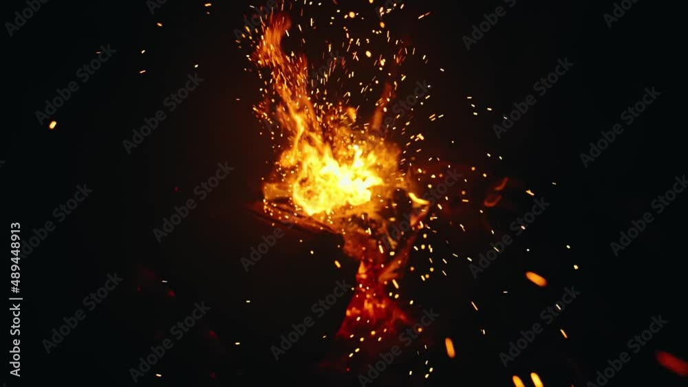 Bonfire in nature. Fire space close up view. Bright stream burn sparks are fly in the camera, at you, into the lens. Slow motion magic cinematic bokeh beautiful flame. Fire defocus, Blur, Bokeh. Bonfire in nature. Fire space close up view. Bright stream burn sparks are fly in the camera, at you, into the lens. Slow motion magic cinematic bokeh beautiful flame. Fire defocus, Blur, Bokeh.