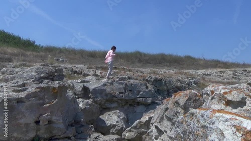 Lady model walking on the edge of sea cliffs kaliakra yaylata bulgaria photo