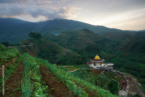 Beautiful terrace plantation with leading line and green plantation of Panyaweuyan Argapura Majalengka. Sunrise with sea of clouds, beautiful natural view for agricultural background photo