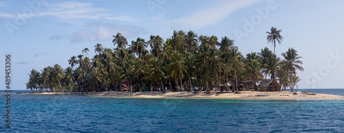 Panorama of sunny and idyllic San Blas Islands with palm trees and no people making a deserted island paradise between Colombia and Panama.
