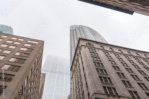 Low angle view of high rise office building shrouded in fog in a financial district. toronto, ON, Canada.
