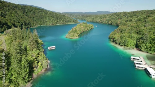 Aerial view of the Plitvice Lakes in the National Park of Croatia. Waterfalls and lakes in Plitvice National Park. Panoramic view of beautiful fresh and virgin nature with green trees on a sunny day. photo