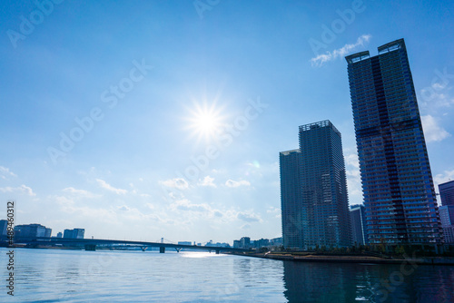 Tower apartments lined up along the river and a refreshing blue sky_36