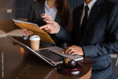 business people and lawyers discussing contract papers sitting at the table. Concepts of law, advice, legal services, legal