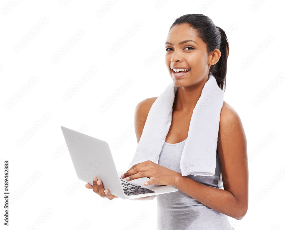 Logging my workout progress. A young woman in gym clothes working on a laptop. Logging my workout progress. A young woman in gym clothes working on a laptop.