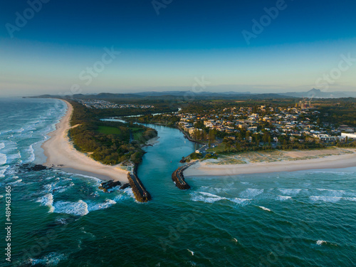 Cudgen Creek mouth at Kingscliff from a drone showing the new Tweed Valley Hospital emerging on the hill. Mt Warning sitting on the horizon