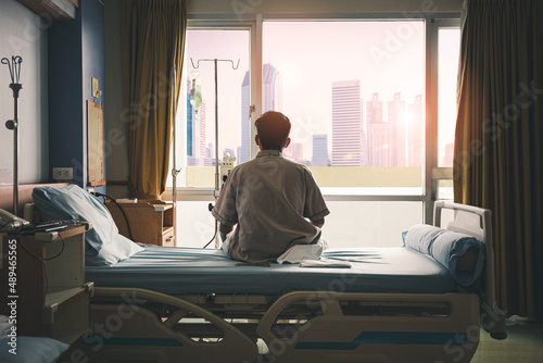 patient sat on the bed and looked out the window in the hospital alone and had stress, boredom, loneliness, anxiety. / Health care and medical