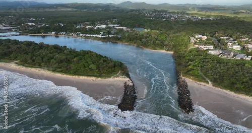 Mooball Creek mouth Pottsville rock walls broken by waves in king tides