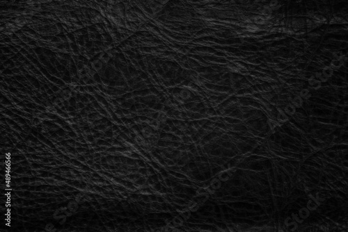 Closeup of seamless black leather texture background, surface material for fashion dark pattern