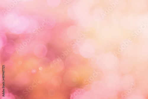 Abstract blurred orange color and peach for background  Blur festival lights outdoor and pink bubble focus texture decoration.