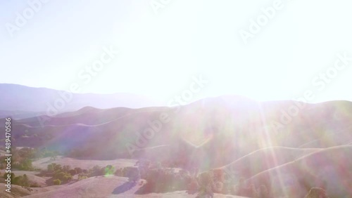 Beautiful outdoor ranch landscapes, shots of a overlanding Toyota 4Runner with a rooftop tent on an off road adventure, vast golden mountain tops with long views of valleys and oak trees and incredibl