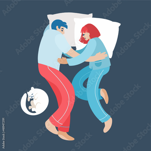 Cute young couple lying in bed and cuddling, view from the top.