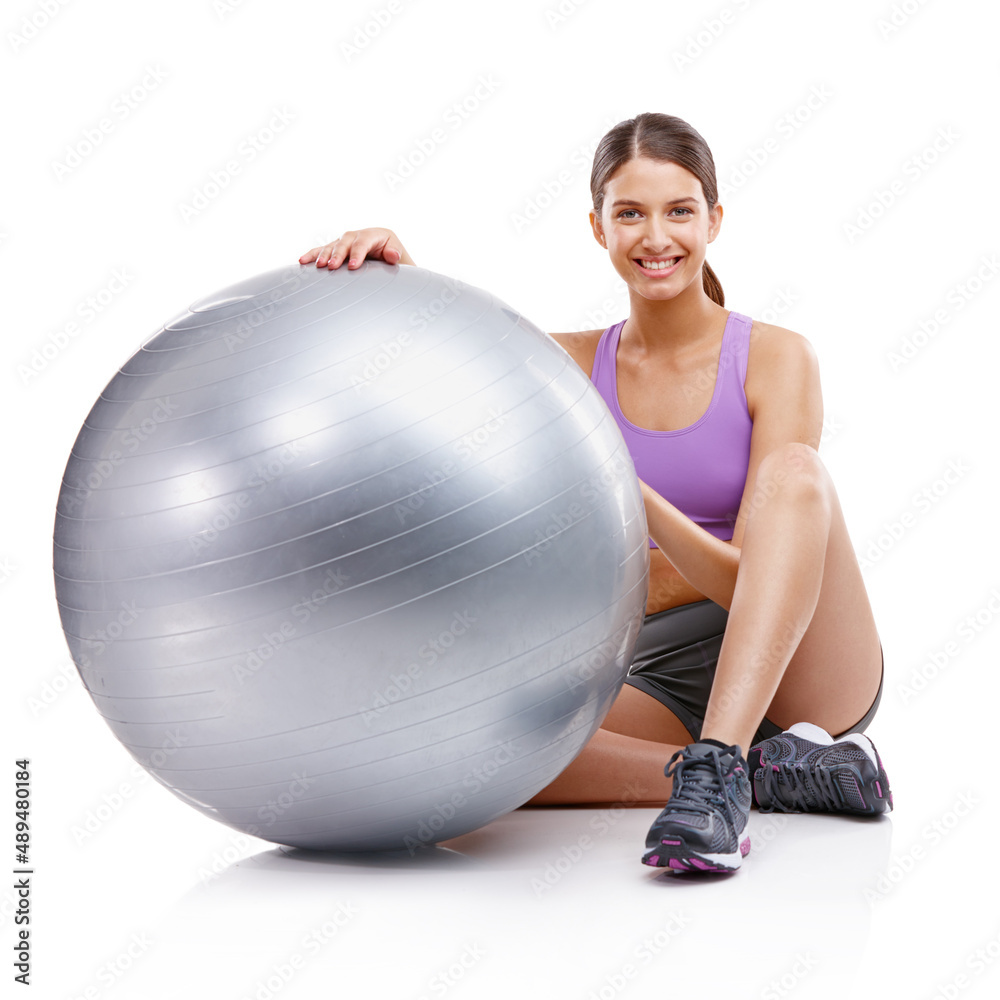 Any exercise is better than no exercise. Portrait of a young woman sitting next to her fitness ball. Any exercise is better than no exercise. Portrait of a young woman sitting next to her fitness ball.