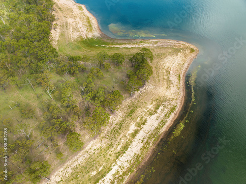 Eungella Dam Queensland Australia with low water levels showing texture in the and pattern in the shallows. photo