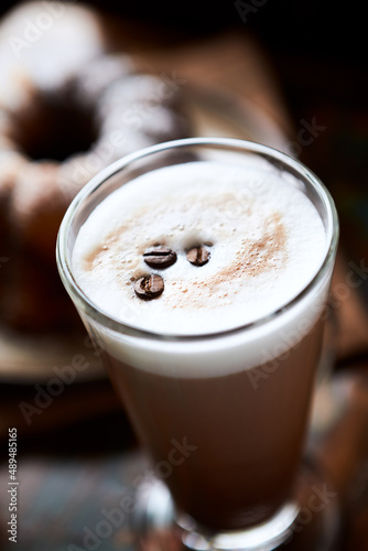 Coffee with milk on dark background. Close up. 