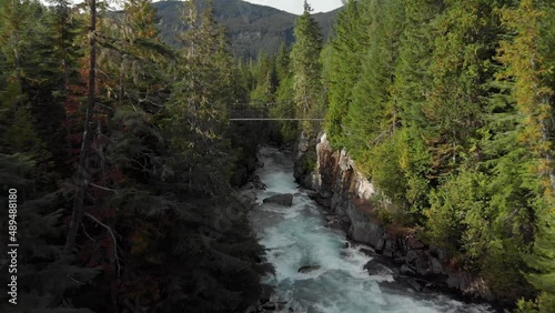 Aerial drone footage, white water river, evergreen forest river Whistler BC, Canada, summer, beautiful flowing river, outdoor alpine. 4K 24FPS.