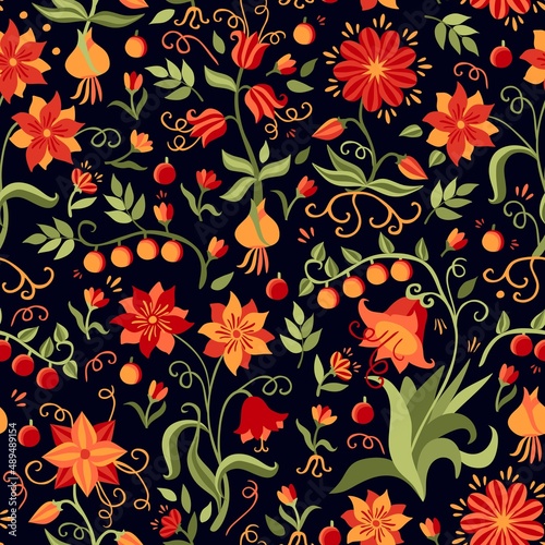 An amazingly beautiful floral print with flowers  bulbs  roots  berries  leaves in orange-red-green tones on a black background. Russian folklore motifs. Seamless pattern for fabric.