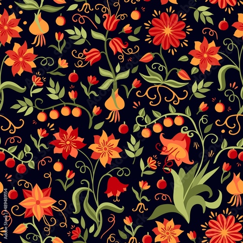 An amazingly beautiful floral print with flowers, bulbs, roots, berries, leaves in orange-red-green tones on a black background. Russian folklore motifs. Seamless pattern for fabric.