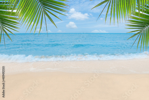 Fototapeta Naklejka Na Ścianę i Meble -  Sand with Palm and tropical beach and sea background. Summer vacation and travel concept.