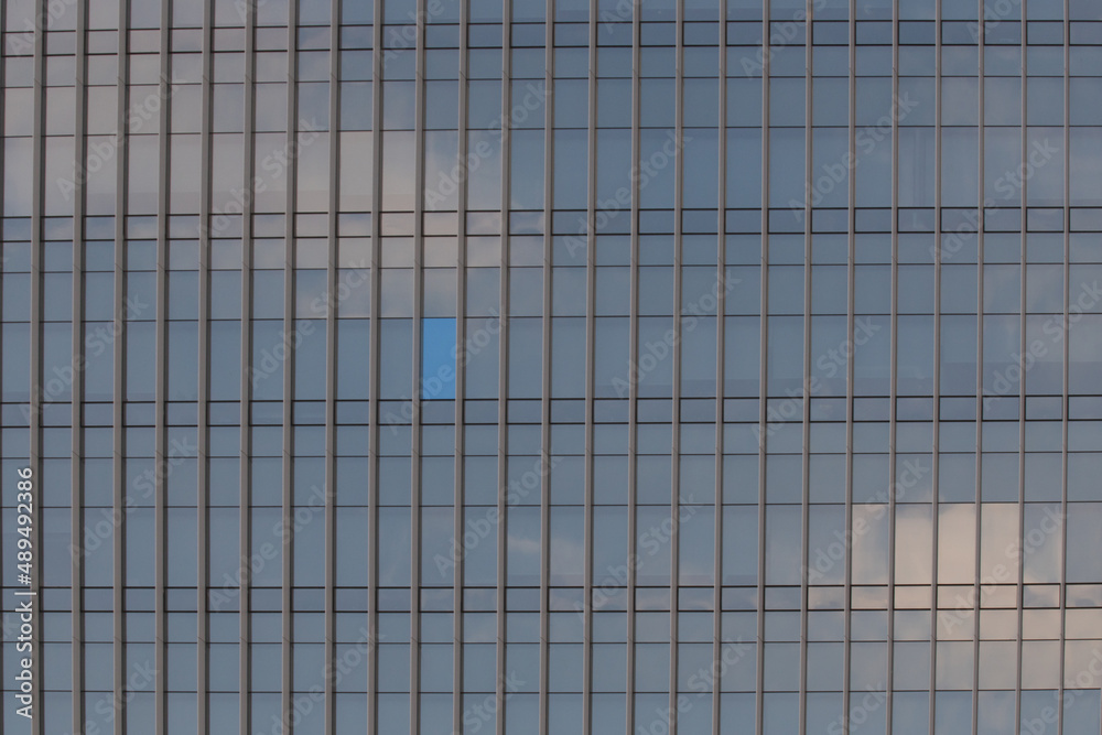 A beautiful reflection of the glass walls of a building A beautiful reflection of the glass walls of a building