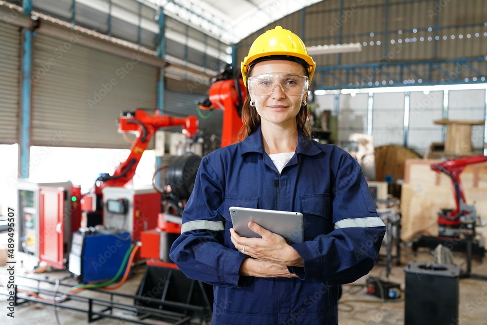 Engineer check and control welding robotics automatic arms machine in intelligent factory automotive industrial with monitoring system software. Digital manufacturing operation. Industry 4.0 Engineer check and control welding robotics automatic arms machine in intelligent factory automotive industrial with monitoring system software. Digital manufacturing operation. Industry 4.0