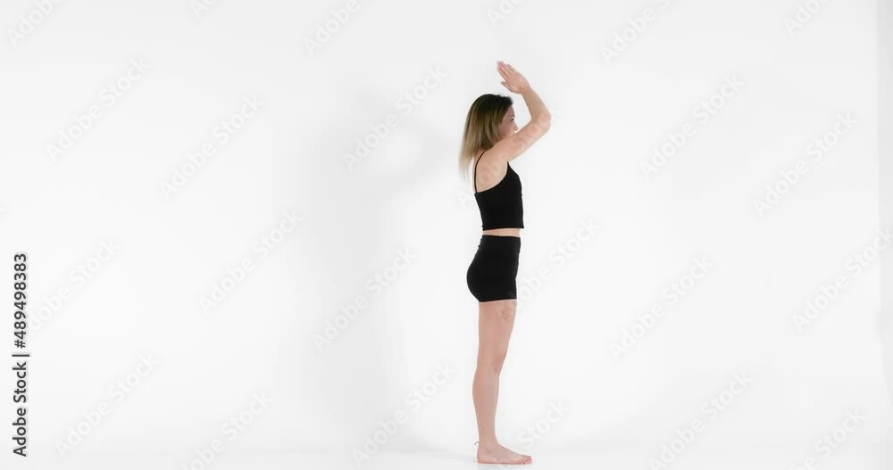 Blonde woman doing yoga exercise in studio closeup Blonde woman doing yoga exercise in studio closeup
