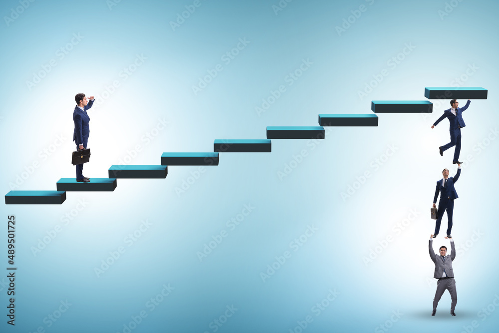 Fototapeta premium Teamwork concept with businessmen helping each other