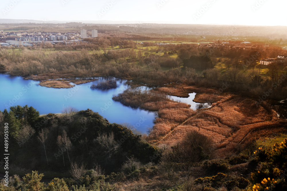 Arthur's Seat is a remarkable secret of an Edinburgh landmark. In this scene, I captured the color mixture of the transition from autumn to winter. The lake and the grass represent the main subjects.