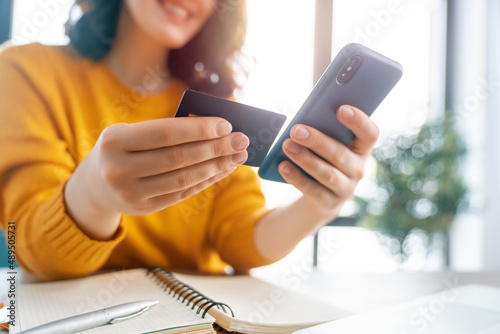 Woman is doing online purchases