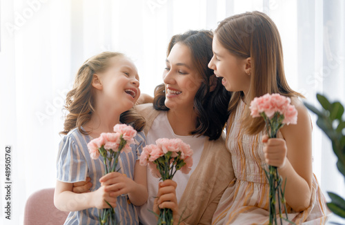 daughters are congratulating mother