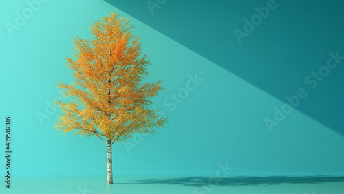 autumn orange tree on pastel blue background with copy space