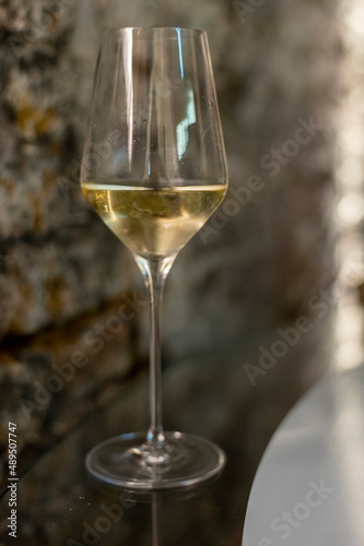 Tasting of brut champagne sparkling wine produced by traditional method in underground caves