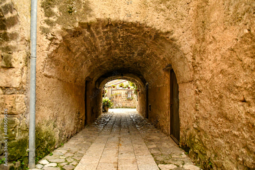 A narrow street among the old stone houses of the oldest district of the city of Caserta.