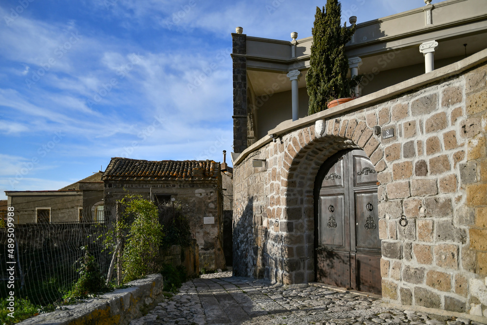 A narrow street among the old stone houses of the oldest district of the city of Caserta. A narrow street among the old stone houses of the oldest district of the city of Caserta.