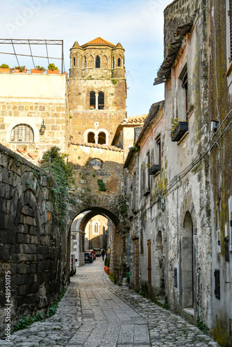 Fototapeta Naklejka Na Ścianę i Meble -  A narrow street among the old stone houses of the oldest district of the city of Caserta.