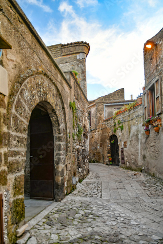 A narrow street among the old stone houses of the oldest district of the city of Caserta.