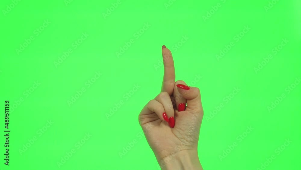 Gestures, Girl’s Hand Shows Indecent Gesture Middle Finger on Green