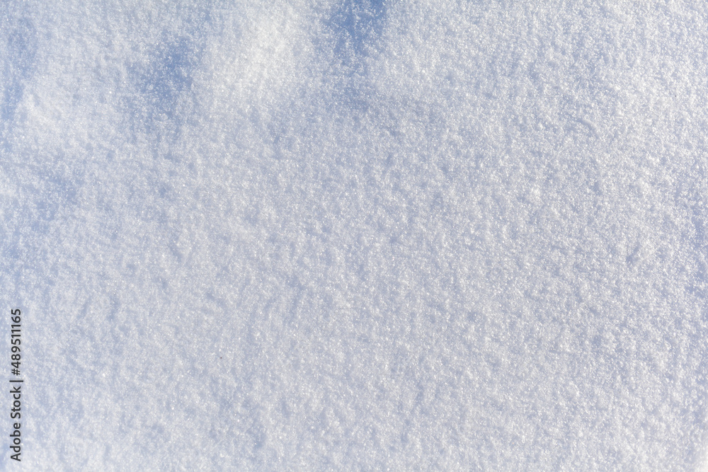 Clean, white snow close-up. Winter background. Snow surface. Fresh fluffy white snow texture.White snowflakes. Clean, white snow close-up. Winter background. Snow surface. Fresh fluffy white snow texture.White snowflakes.