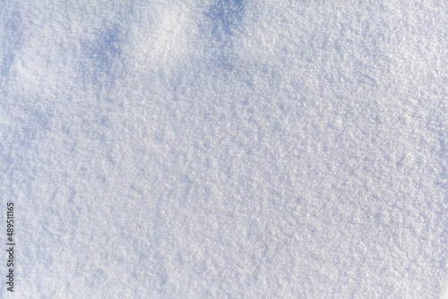 Clean, white snow close-up. Winter background. Snow surface. Fresh fluffy white snow texture.White snowflakes.