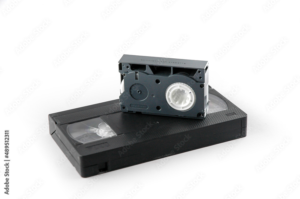 Old video cassettes on a white background in soft lighting. VHS and VHS