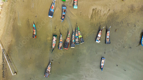 Aerial photo of fishing boats parked at the fishing port in Seungko Mulat village, Aceh, Indonesia. photo