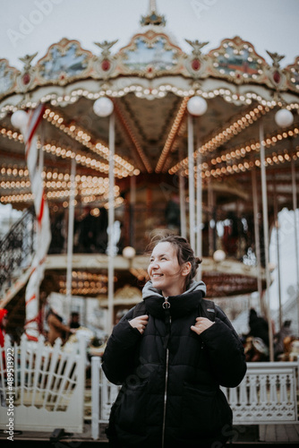 person on a carousel in the park