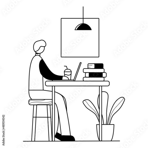 The man studies at the cafe